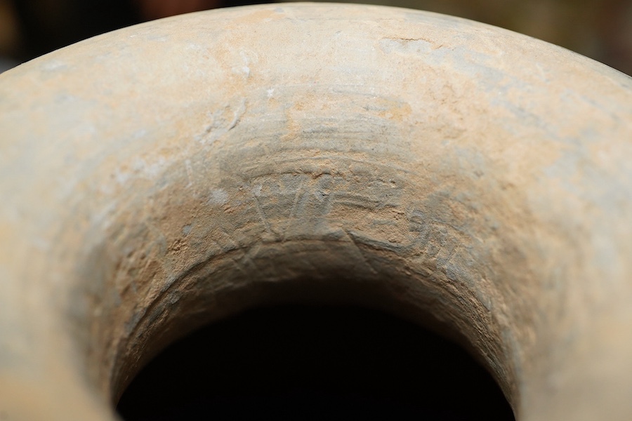 Four very rare Chinese inscribed pottery jars, Han dynasty